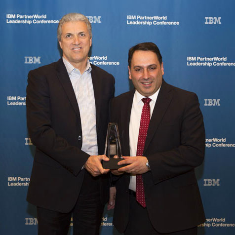 Mike Gerentine - IBM Global Vice President, presents Andy Andrews with the IBM Beacon Award finalist trophy